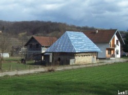 Traditional hay-loft with the common new kind of roof...