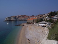 Beach, restaurant, and wonderful color of the water